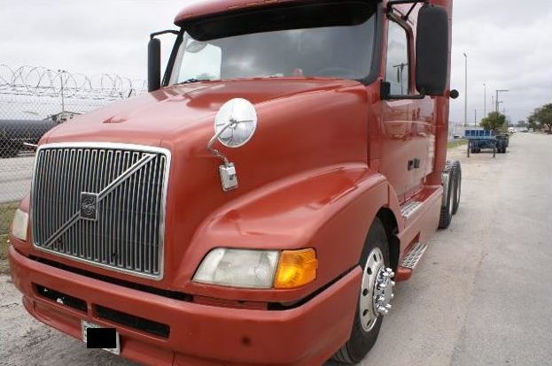 front (cab) of red tractor-trailer