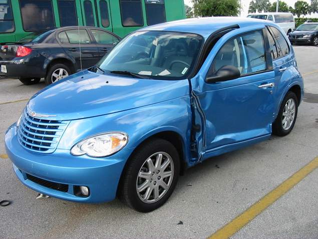 Door of rental car dented after it and a pedestrian were hit by US customs employee driving car in Miami-Dade County Florida.