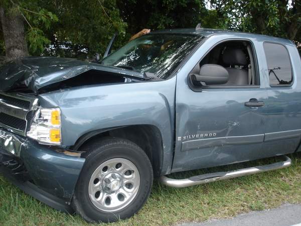 Damage to front and driver side of Chevrolet Silverado truck.
