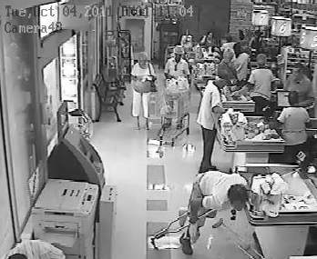 video of shopper in supermarket in air during fall on slippery substance