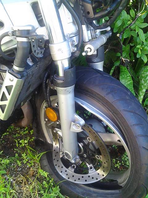 damage to front wheel and tire of a motorcycle