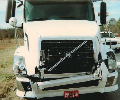 Damage to truck evidences a hard impact.