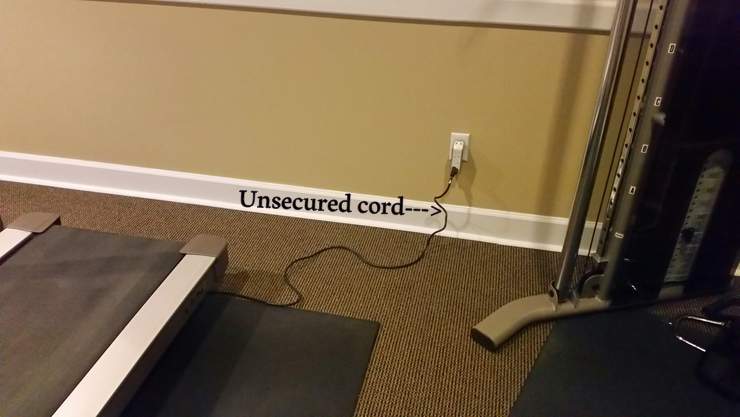 Unsecured Power cord in the gym at a Pinecrest, Miami Florida condominium building gym. 