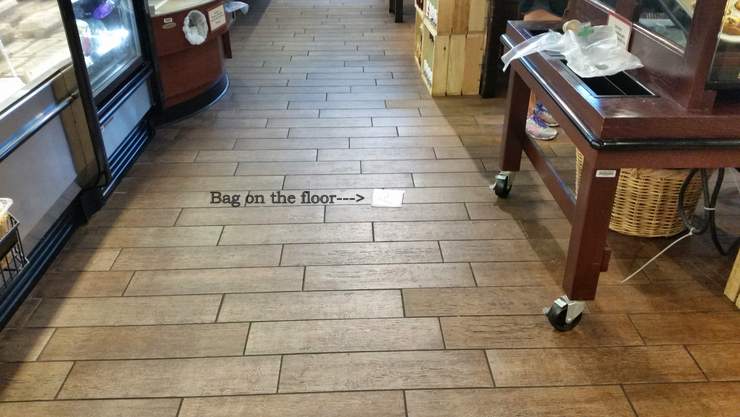 Slip and fall on a bag on the floor at a Miami, Florida supermarket.