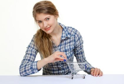 Young lady holding shopping cart