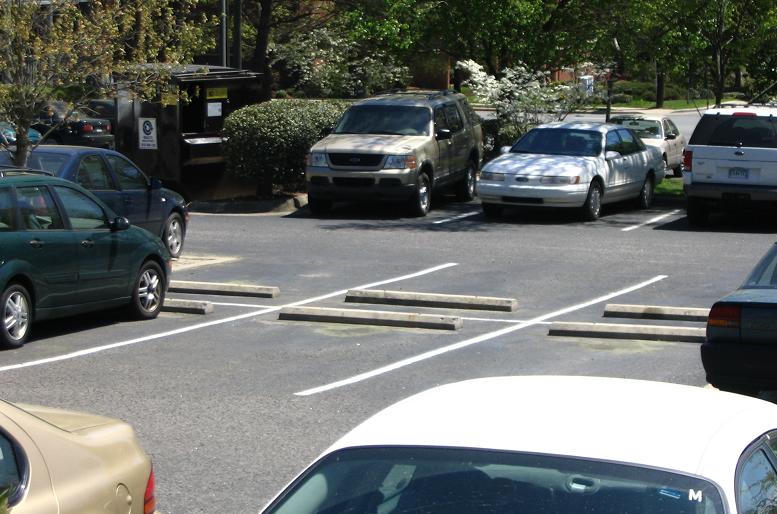 parking lot with bumpers (wheel stops)_