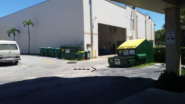 rod sticking out of the ground in parking lot- facing East