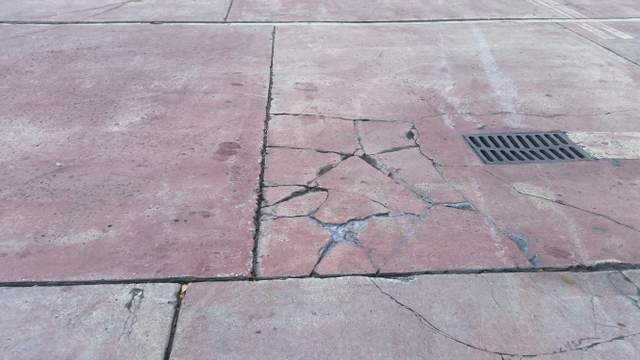 Cracks in pavement at a Coral Gables, Miami-Dade County, Florida gas station