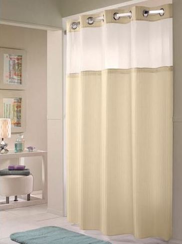 shower curtain hanging beneath bathtub rim