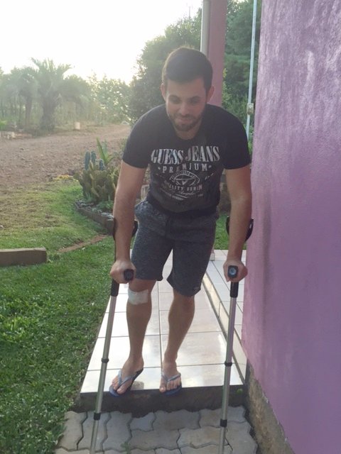 Injured car accident victim using Crutches after his meniscus surgery.