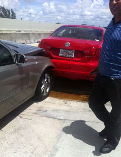 damage to front of car in crash on Miami highway