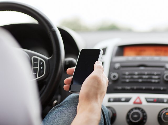 Uber driver using phone while driving