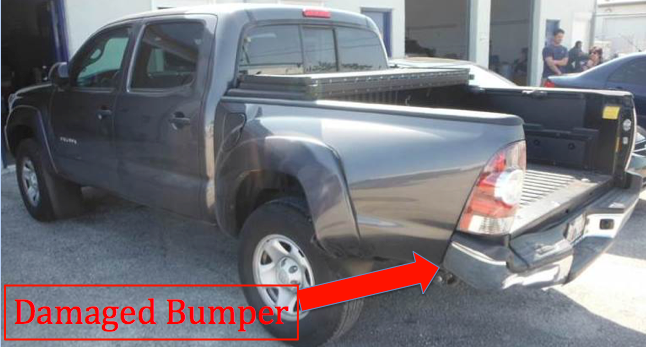 damaged rear bumper of pickup truck after getting rear ended by a car
