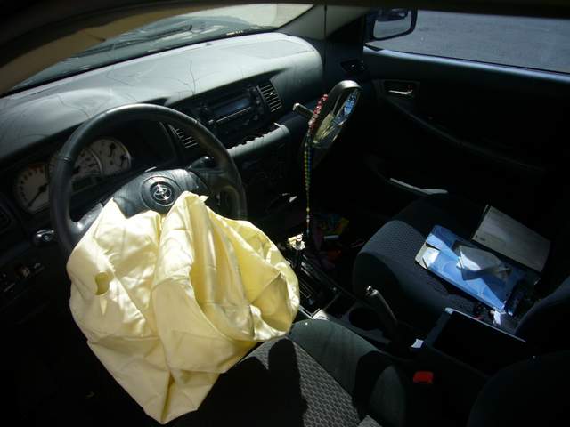 Airbag deployed in driver's steering wheel after car crash