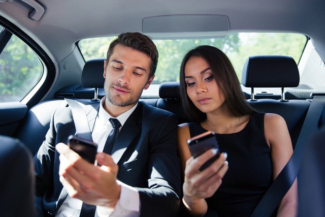 passengers in back seat of car