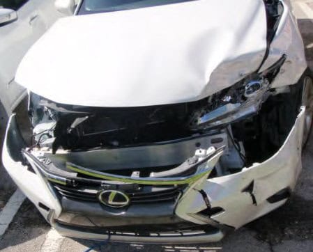 damage to front hood and fender of Lexus car after a T-bone accident