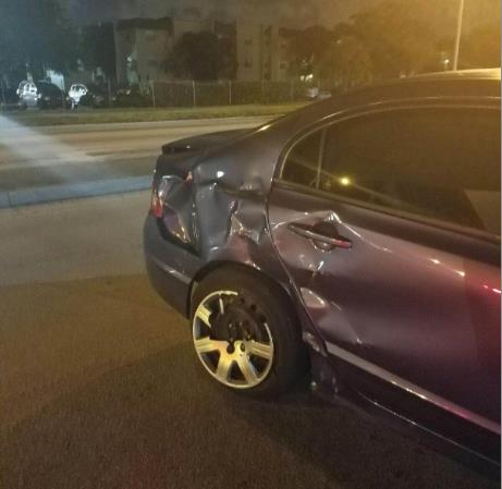 Photo of damage to rear passenger side door