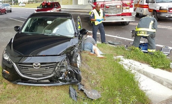 driver on ground after car accident