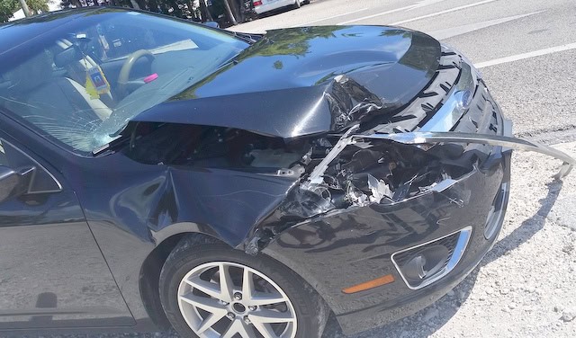 front end and hood damage to car that hit the back of a pickup truck up