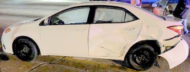 driver side damage to car that was hit by an SUV