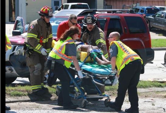 photo of lady on stretcher - online news