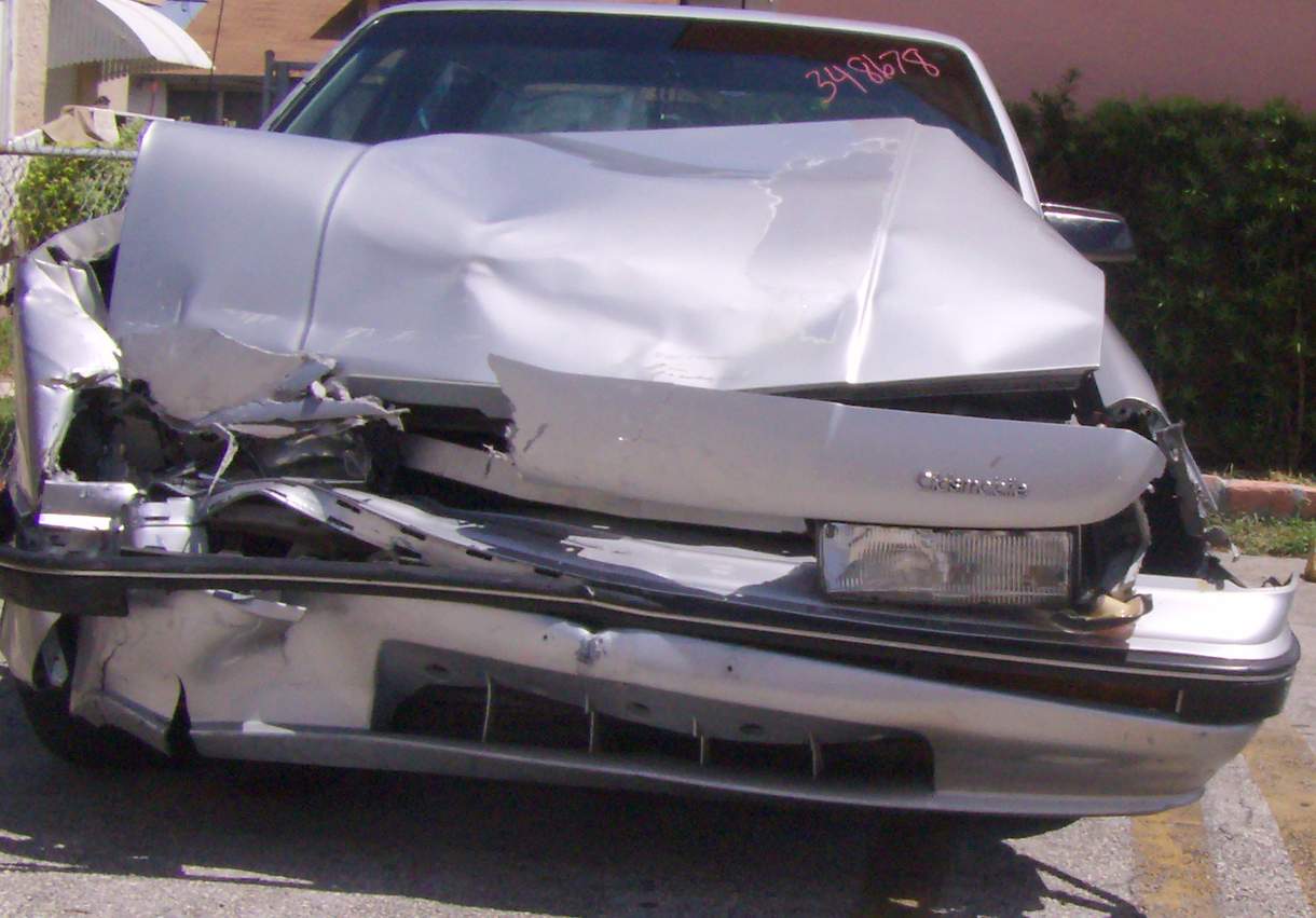 damage to front and side of car and hood