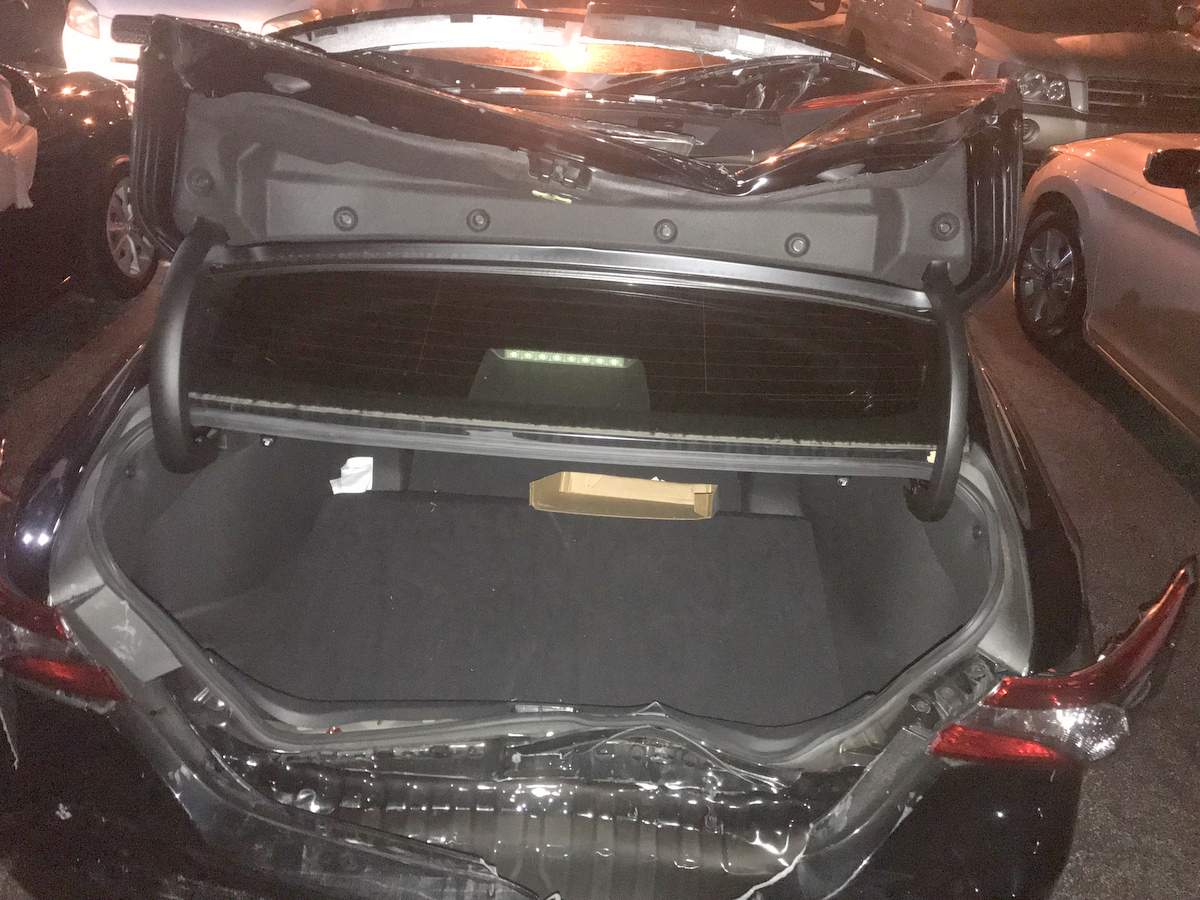 rear end damage to trunk and bumper after a car accident