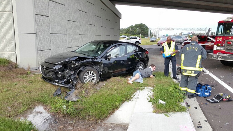 driver on the ground suffering a personal injury after car accident