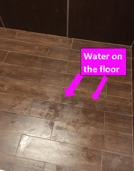 water on the wooden floor  