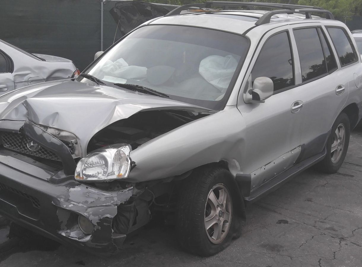 damage to front and front driver side of SUV