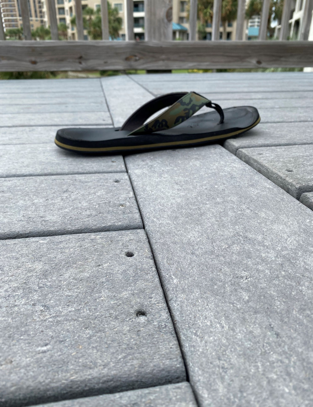 sandal laying on boardwalk attempting to show change of elevation 