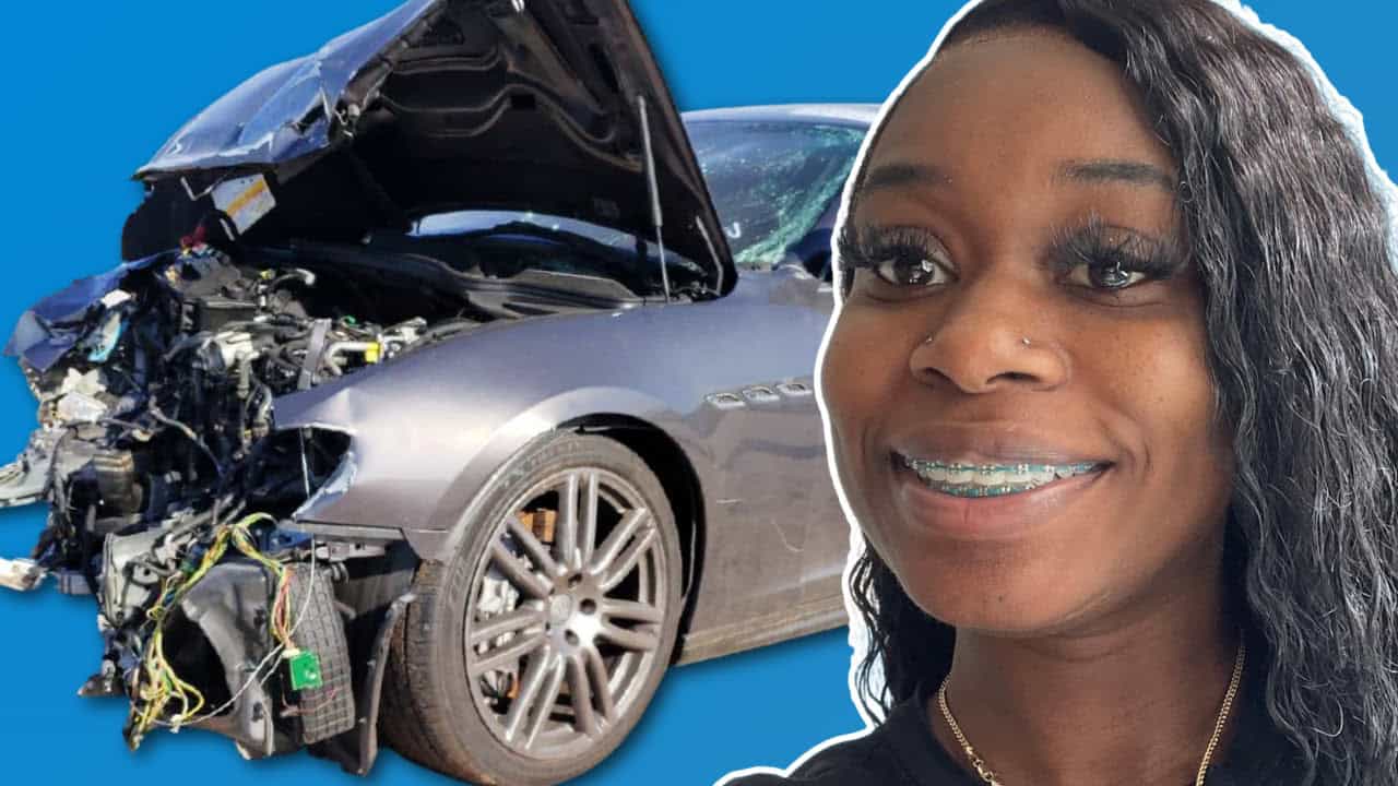 woman next to damaged front of car