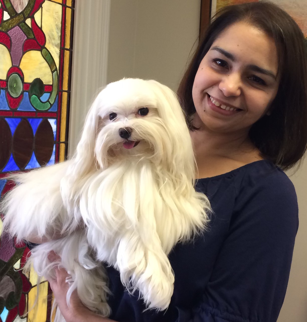 Paralegal Jenny holding her dog Jimmy